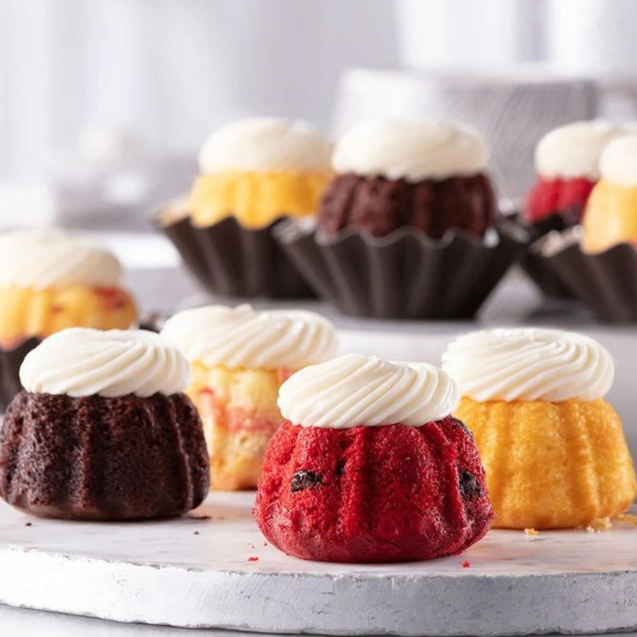 Bundtinis are charming mini cakes available in a variety of flavors like Red Velvet, Chocolate Chocolate Chip, and Lemon. Their elegant size and delicious taste make them a perfect complement to any floral arrangement. Ideal for all occasions — from birthdays and anniversaries to corporate gifts and thank-you gestures — they add a tasteful, personal touch to your gift.