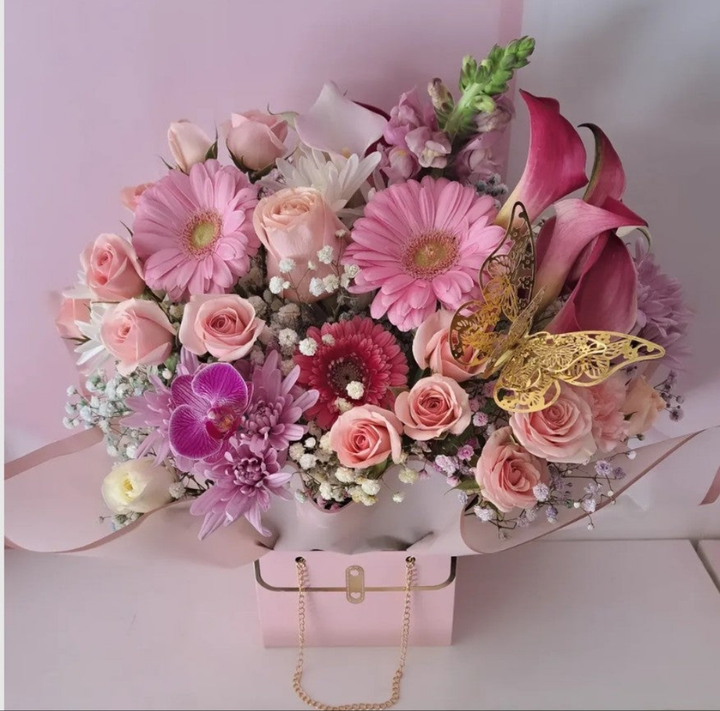 Discover a splendid collection of seasonal floral bouquets. Each unique arrangement is a stunning dichotomous mix of breathtaking color combinations. This incredibly beautiful and bountiful arrangement boasts a lush selection of fresh flowers, featuring the perfect hues and a delightful variety of blossoms. Flowers are not just a gift; they are the finest way to celebrate, brighten someone’s day, or express sentimental love and feelings.