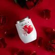 Load image into Gallery viewer, White tumbler with red heart design on a red background with roses
