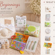 Load image into Gallery viewer, Sweet Beginnings Baby Gift Set displayed on a beige surface with a pink teddy bear, white plush blanket, packaged baby items, and a printed inclusion list on the right.
